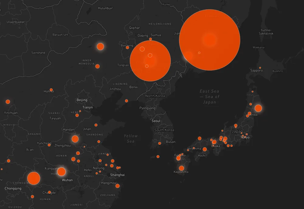 Dark theme map closeup of China, showing meteorite falls as orange circles, with larger mass meteorites as larger circles.